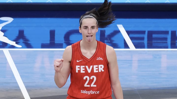 Indiana Fever guard Caitlin Clark sticks out her tongue as she reacts to a play against the Phoenix Mercury at Gainbridge Fieldhouse on August 16, 2024 in Indianapolis, Indiana. 