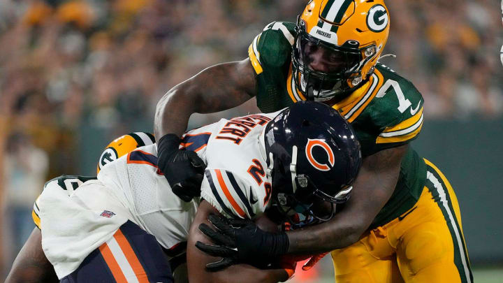 Packers linebacker Quay Walker tackles Bears running back Khalil Herbert.