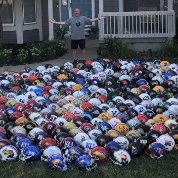 He has so many football helmets we couldn't fit them all in the picture