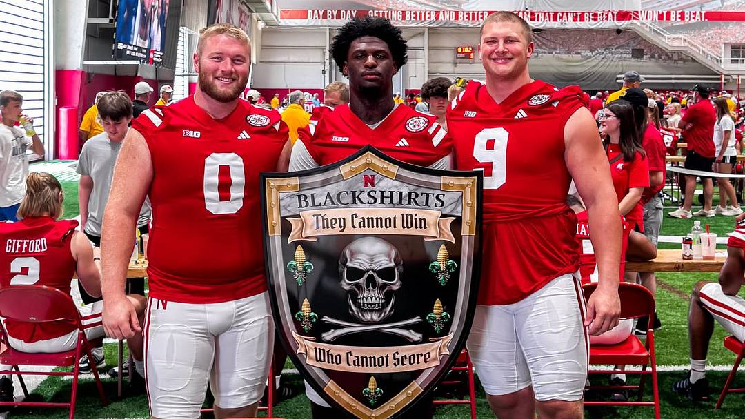 Nash Hutmacher, Jimari Butler and Ty Robinson pose with a Blackshirts shield during 2024 Nebraska football Fan Day. Nash Hutmacher, Jimari Butler and Ty Robinson pose with a Blackshirts shield during 2024 Nebraska football Fan Day.
