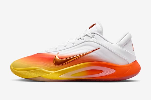Side view of A'ja Wilson's white, orange, and yellow Nike shoes. Side view of A'ja Wilson's white, orange, and yellow Nike shoes.
