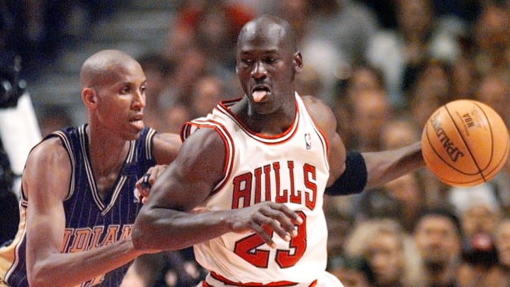 May 31, 1998; Chicago, IL, USA; Chicago Bulls guard Michael Jordan (23), right, is guarded by Indiana Pacers player Reggie Miller (31) in the second half at the United Center.  Mandatory Credit: Anne Ryan-USA TODAY