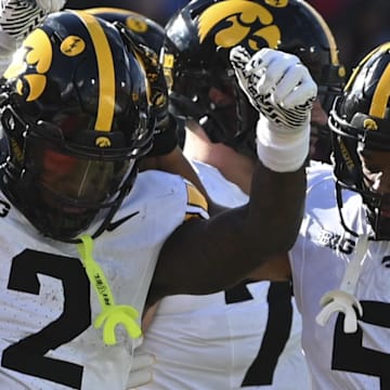 Nov 23, 2024; College Park, Maryland, USA;  Iowa Hawkeyes running back Kaleb Johnson (2) celebrates after scoring a touchdown during the first half against the Maryland Terrapins at SECU Stadium. Mandatory Credit: Tommy Gilligan-Imagn Images