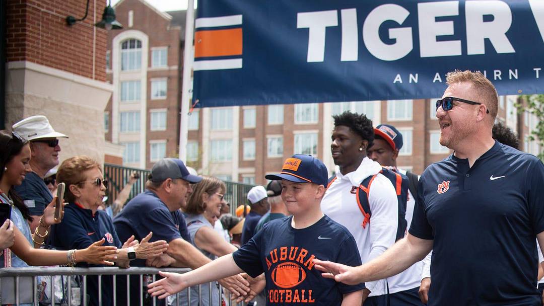 Auburn Tigers head coach Alex Golesh leads his team during Tiger Walk before Auburn Tigers A-Day spring game at Jordan-Hare Stadium in Auburn, Ala. on Saturday, April 18, 2026.