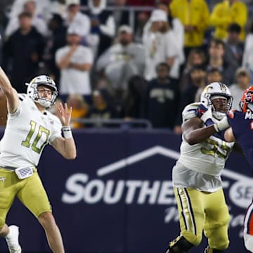 Nov 18, 2023; Atlanta, Georgia, USA; Georgia Tech Yellow Jackets quarterback Haynes King (10) throws a pass against the Syracuse Orange in the first half at Bobby Dodd Stadium at Hyundai Field. Mandatory Credit: Brett Davis-Imagn Images
