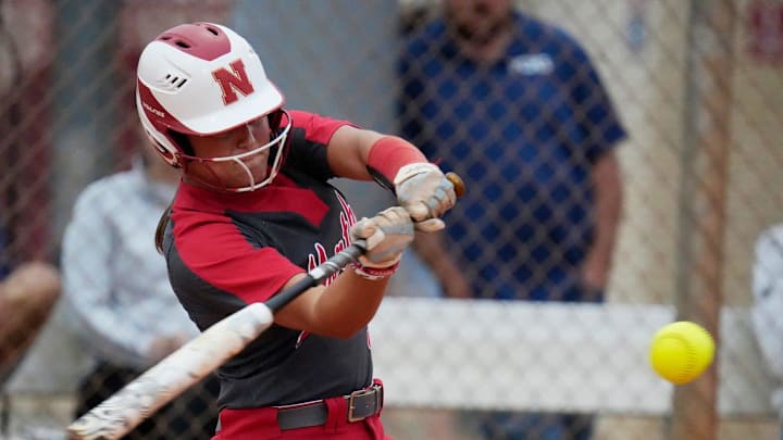 North Fort Myers player Abigail Hynes gets a base hit. The North Fort Myers High School softball team hosted Parrish Community for a non-district matchup Tuesday, April 8, 2025.The Parrish Community Bulldogs won with a final score of 5-2.