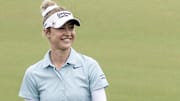 Apr 19, 2024; The Woodlands, Texas, USA; Nelly Korda (USA) smiles as she walks the ninth fairway
