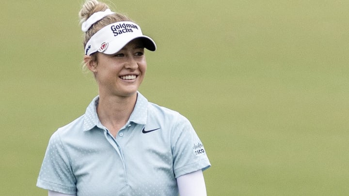 Apr 19, 2024; The Woodlands, Texas, USA; Nelly Korda (USA) smiles as she walks the ninth fairway