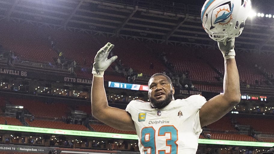 Dec 29, 2024; Cleveland, Ohio, USA; Miami Dolphins defensive tackle Calais Campbell (93) celebrates as he leaves the field following the win against the Cleveland Browns at Huntington Bank Field. Mandatory Credit: Scott Galvin-Imagn Images | Scott Galvin-Imagn Images