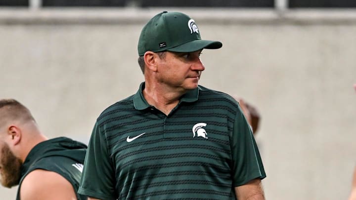 Michigan State's head coach Jonathan Smith looks on during team warm ups before the game against Florida Atlantic on Friday, Aug. 30, 2024, at Spartan Stadium in East Lansing.