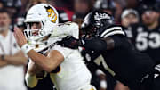 Arizona State Sun Devils quarterback Sam Leavitt (10) runs the ball as Mississippi State Bulldogs linebacker Zakari Tillman (7) makes the tackle during the second quarter at Davis Wade Stadium at Scott Field.\