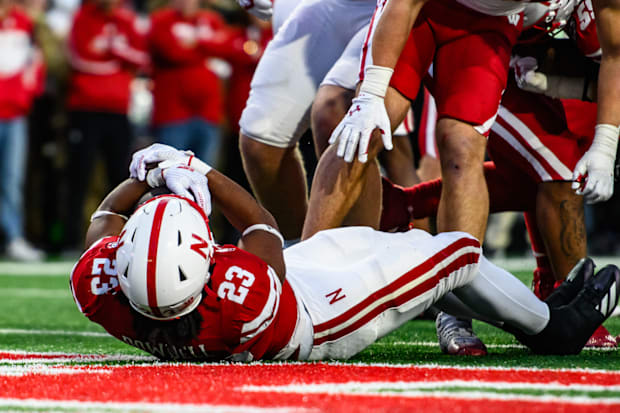 Dante Dowdell (23) lands in the endzone for another Husker touchdown. 
