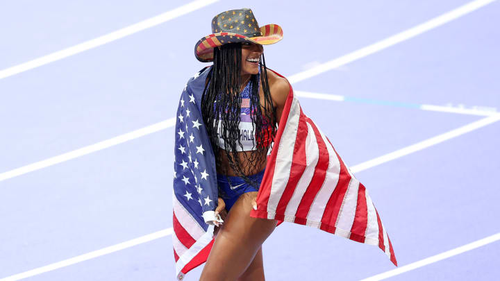 Tara Davis-Woodhull celebrates winning the long jump gold medal.