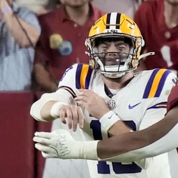 Alabama defensive lineman James Smith (23) forces a bad throw on third down play from LSU quarterback Garrett Nussmeier (18) at Saban Field at Bryant-Denny Stadium.