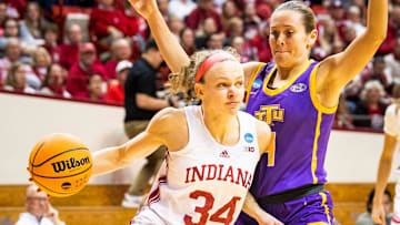 Indiana's Grace Berger (34) passes around Tennessee Tech's Anna Walker (4) during the first round of the NCAA women's tournament at Simon Skjodt Assembly Hall on Saturday, March 18, 2023.

Iu Tt Wbb 2h Berger 2