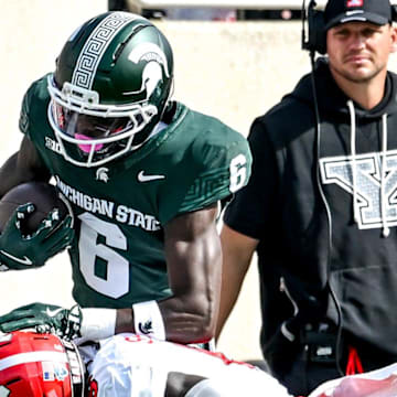 Michigan State's Nick Marsh, top, catches a pass as Youngstown State's Makai Shahid closes in during the first quarter on Saturday, Sept. 13, 2025, at Spartan Stadium in East Lansing.