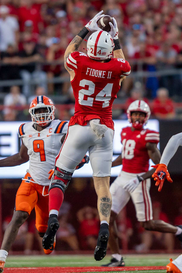 Nebraska tight end Thomas Fidone II catches a pass that turns into a 17-yard gain against Illinois.