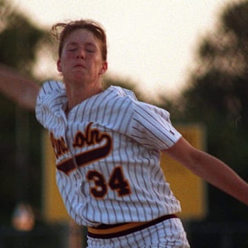 Lisa Birocci of Lincoln winds up for a pitch against an East batter on Thursday night at Lincoln. Birocci gave up just one hit to lead the Railsplitters to a 2-0 victory over the Scarlets.