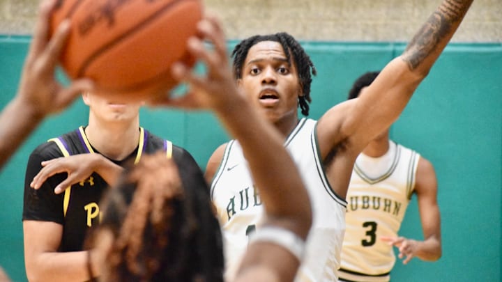 Led by Carter Hansen and Miles Henry, here, Auburn defeated Puyallup to advance to the Class 4A D3/4 boys basketball championship game against Camas. Led by Carter Hansen and Miles Henry, here, Auburn defeated Puyallup to advance to the Class 4A D3/4 boys basketball championship game against Camas.