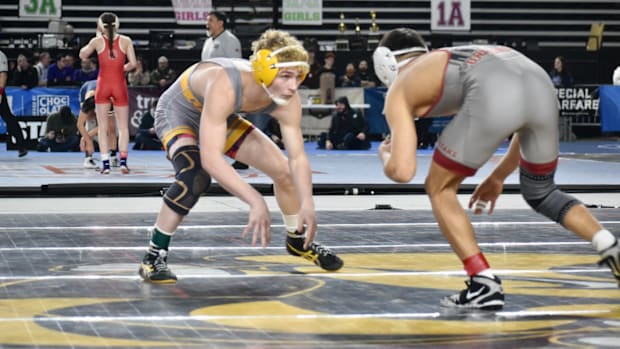 Czar Quintanilla, of University, won his showdown against Lincoln of Tacoma's William Ross, 7-1, in Class 3A finals at 126.