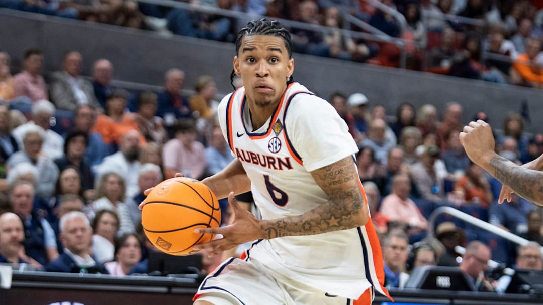 Auburn Tigers guard Elyjah Freeman (6) drives the ball as Auburn Tigers take on Nevada Wolfpack during the third round of the National Invitation Tournament at Neville Arena in Auburn, Ala. on Wednesday, March 25, 2026. Auburn Tigers lead Nevada Wolfpack 38-26 at halftime. Auburn Tigers guard Elyjah Freeman (6) drives the ball as Auburn Tigers take on Nevada Wolfpack during the third round of the National Invitation Tournament at Neville Arena in Auburn, Ala. on Wednesday, March 25, 2026. Auburn Tigers lead Nevada Wolfpack 38-26 at halftime.