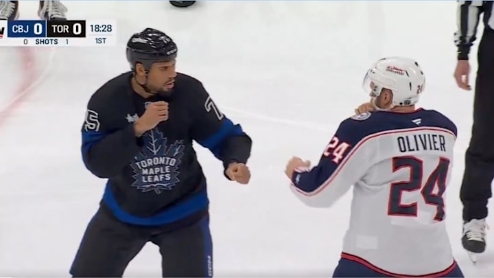 Toronto Maple Leafs' Ryan Reaves and Columbus Blue Jackets' Mathieu Olivier drop gloves. Toronto Maple Leafs' Ryan Reaves and Columbus Blue Jackets' Mathieu Olivier drop gloves.