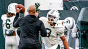 Michigan State defensive back Jeremiah Hughes, center, runs a drill during football practice on Tuesday, April 8, 2025, in East Lansing.