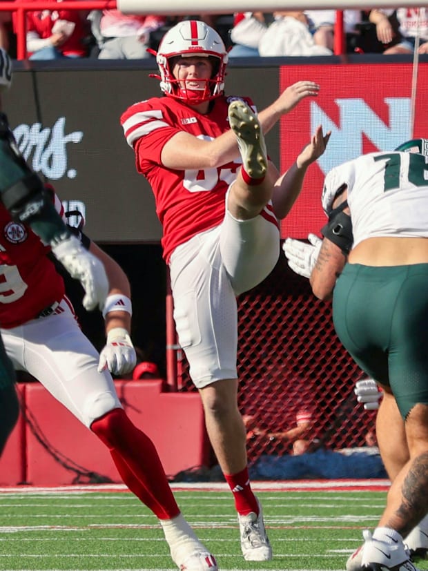 Nebraska's Archie Wilson punts the ball against Michigan State.