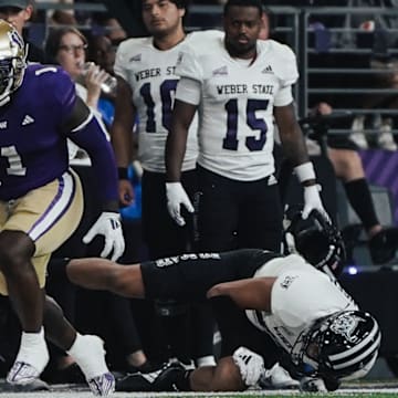 Jonah Coleman leaves players sprawled and watching in the UW season opener. 