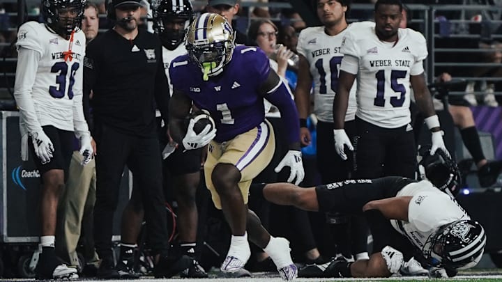 Jonah Coleman leaves players sprawled and watching in the UW season opener. 