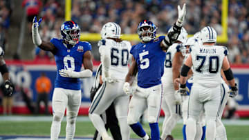 Sep 26, 2024; East Rutherford, NJ, US; New York Giants linebacker Brian Burns (0) and New York Giants linebacker Kayvon Thibodeaux (5) celebrate after sacking Dallas Cowboys quarterback Dak Prescott (4) at MetLife Stadium. Mandatory Credit: Julian Guadalupe-NorthJersey.com