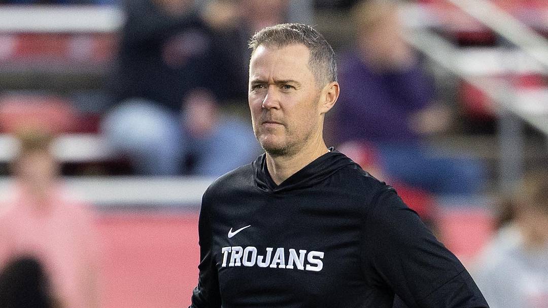 Oct 24, 2026; Madison, Wisconsin, USA;  USC Trojans head coach Lincoln Riley watches his team during warmups before the game against the Wisconsin Badgers at Camp Randall Stadium.  Mandatory Credit: Anthony Wahl-Imagn Images
