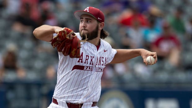 Razorbacks' Zach Root (33) pitches against the Ole Miss Rebels during the SEC baseball tournament