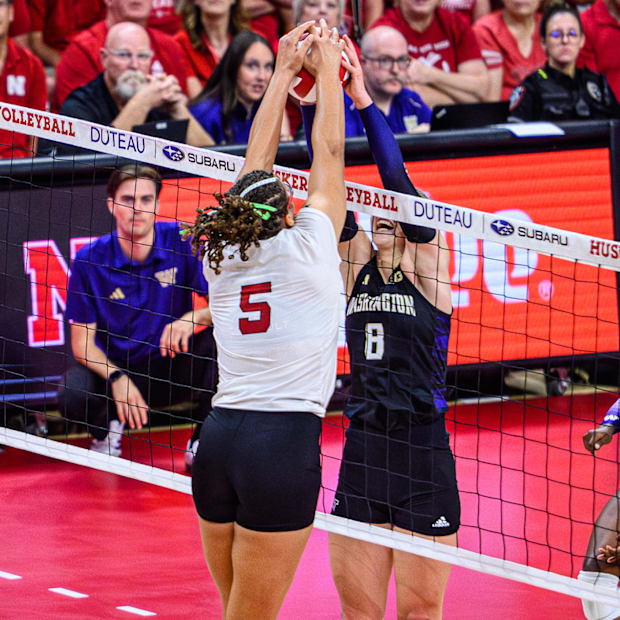 Rebekah Allick (5) fights for possession of the ball with Washington's Alexis Haury (8). 