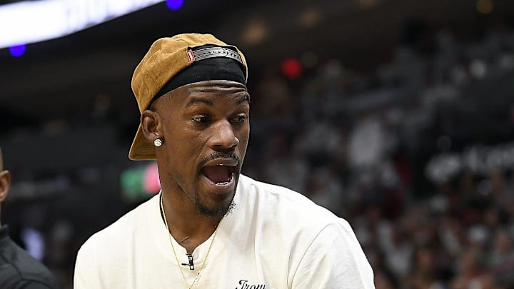 Apr 29, 2024; Miami, Florida, USA; Miami Heat forward Jimmy Butler (22) comments on the game from the bench during the first quarter of game four of the first round for the 2024 NBA playoffs, against the Boston Celtics, at Kaseya Center. Mandatory Credit: Michael Laughlin-Imagn Images