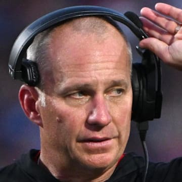 Sep 20, 2025; Durham, North Carolina, USA;  NC State Wolfpack head coach Dave Doeren reacts to a call during the fourth quarter against the Duke Blue Devils at Wallace Wade Stadium. Mandatory Credit: Zachary Taft-Imagn Images