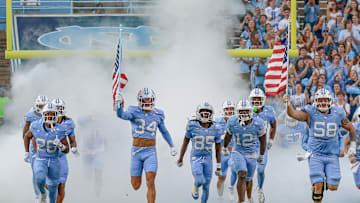 North Carolina running on the field before its game vs. Stanford; Nov. 8, 2025