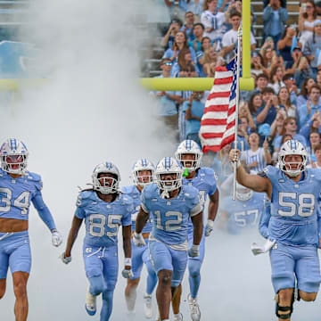 North Carolina running on the field before its game vs. Stanford; Nov. 8, 2025