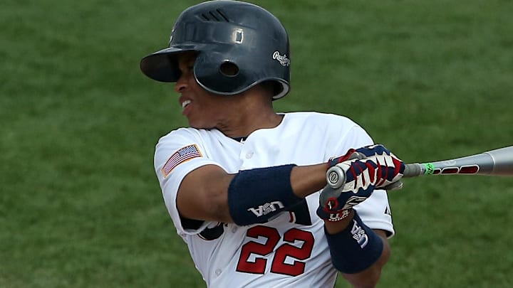 Jul 20, 2015; Toronto, Ontario, CAN; United States left fielder Tamara Holmes (22) hits an RBI double in the third inning against Venezuela during the 2015 Pan Am Games at Ajax Pan Am Ballpark. Holmes, a three-time gold medalist, has been announced as a manager for the Rockford Peaches in the 2025 All-American Women's Baseball Classic, powered by USA Baseball.