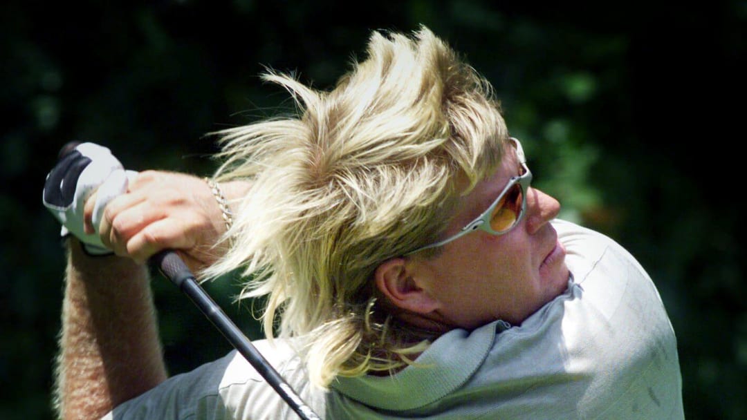 John Daly smacks a ball off the tee for a long drive on the front nine during the 1999 Vinny golf tournament held by Vince Gill on Aug. 2, 1999, in Nashville, Tenn.