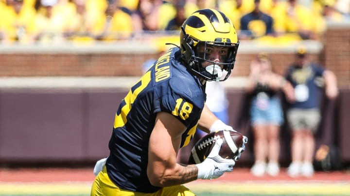 Michigan tight end Colston Loveland (18) makes a catch against East Carolina defensive back Julius Wood (4) during the first half at Michigan Stadium in Ann Arbor on Saturday, Sept. 2, 2023.