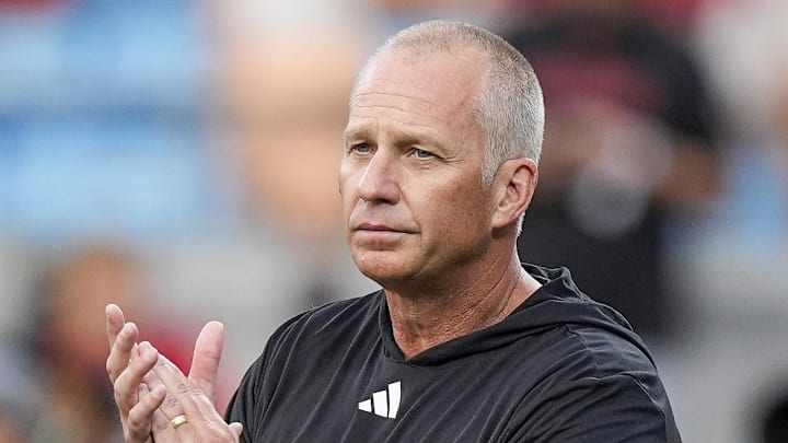 Sep 7, 2024; Charlotte, North Carolina, USA; North Carolina State Wolfpack head coach Dave Doeren during pregame activities against the Tennessee Volunteers at the Dukes Mayo Classic at Bank of America Stadium. Mandatory Credit: Jim Dedmon-Imagn Images Sep 7, 2024; Charlotte, North Carolina, USA; North Carolina State Wolfpack head coach Dave Doeren during pregame activities against the Tennessee Volunteers at the Dukes Mayo Classic at Bank of America Stadium. Mandatory Credit: Jim Dedmon-Imagn Images