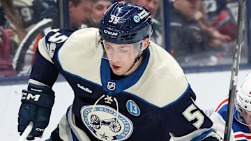 Mar 15, 2025; Columbus, Ohio, USA;  Columbus Blue Jackets right wing Yegor Chinakhov (59) controls the puck as New York Rangers defenseman Urho Vaakanainen (18) defends during the second period at Nationwide Arena. Mandatory Credit: Joseph Maiorana-Imagn Images