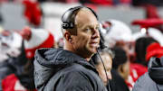 Nov 29, 2025; Raleigh, North Carolina, USA;  NC State Wolfpack head coach Dave Doeren reacts during the first half of the game against North Carolina Tar Heels at Carter-Finley Stadium.  Mandatory Credit: Jaylynn Nash-Imagn Images