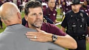 Sep 6, 2025; Blacksburg, Va.; Vanderbilt head coach Clark Lea and Virginia Tech head coach Brent Pry after the game at Lane Stadium.
