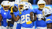 Oct 29, 2023; Inglewood, California, USA; Los Angeles Chargers cornerback Asante Samuel Jr. (26) celebrates with other teammates after Chicago Bears failed attempt on fourth down during third quarter at SoFi Stadium. Mandatory Credit: Jonathan Hui-Imagn Images