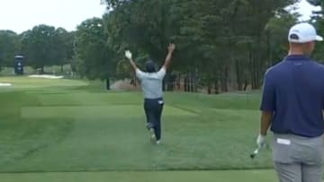 Si Woo Kim celebrates making a hole in one at the PGA Championship.