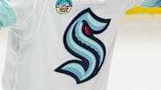 A Seattle Kraken logo on a white jersey.