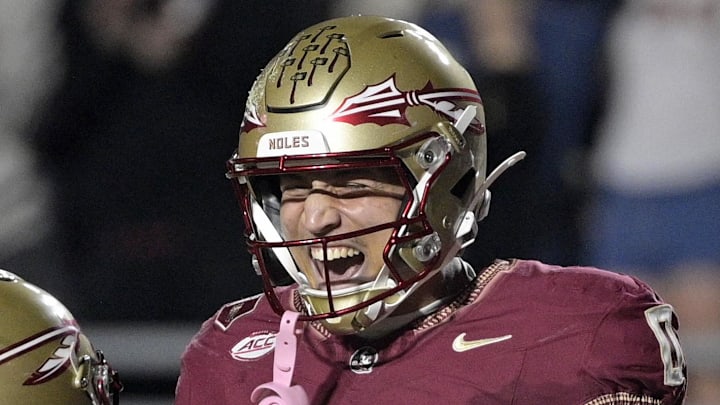 Nov 1, 2025; Tallahassee, Florida, USA; Florida State Seminoles quarterback Tommy Castellanos (1) celebrates a touchdown with wide receiver Duce Robinson (0) during the second half against the Wake Forest Demon Deacons at Doak S. Campbell Stadium. Mandatory Credit: Melina Myers-Imagn Images Nov 1, 2025; Tallahassee, Florida, USA; Florida State Seminoles quarterback Tommy Castellanos (1) celebrates a touchdown with wide receiver Duce Robinson (0) during the second half against the Wake Forest Demon Deacons at Doak S. Campbell Stadium. Mandatory Credit: Melina Myers-Imagn Images