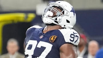 Nov 28, 2024; Arlington, Texas, USA;  Dallas Cowboys defensive tackle Osa Odighizuwa (97) celebrates after a sack against the New York Giants during the second half at AT&T Stadium. Mandatory Credit: Chris Jones-Imagn Images
